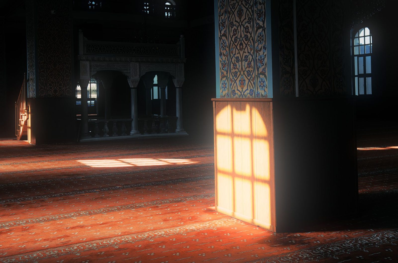 Loş cami içinde pencereden sütuna ve halıya vuran gün ışığı