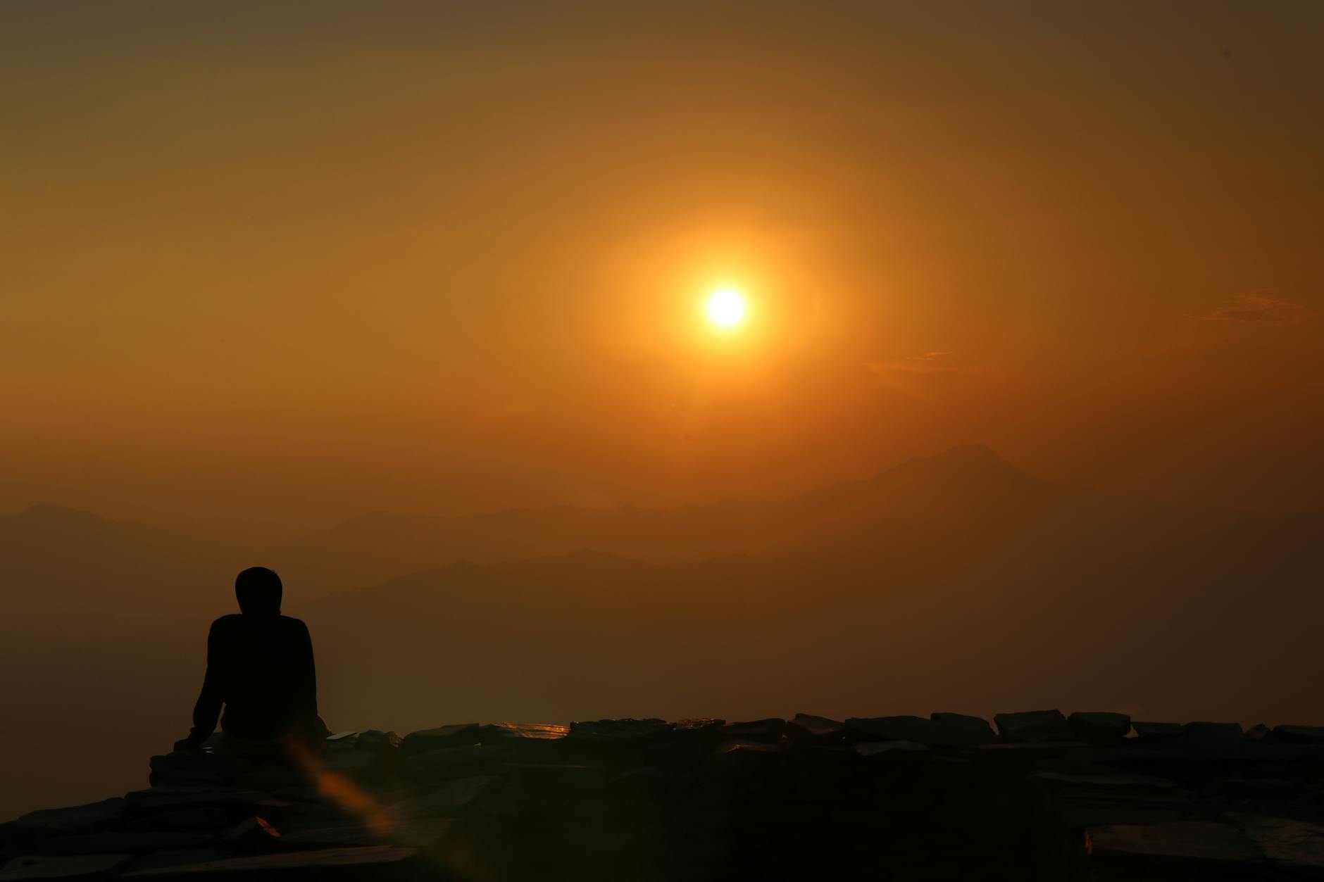 Beginning to know yourself spiritually — a solitary silhouette at sunrise, attention turned inward