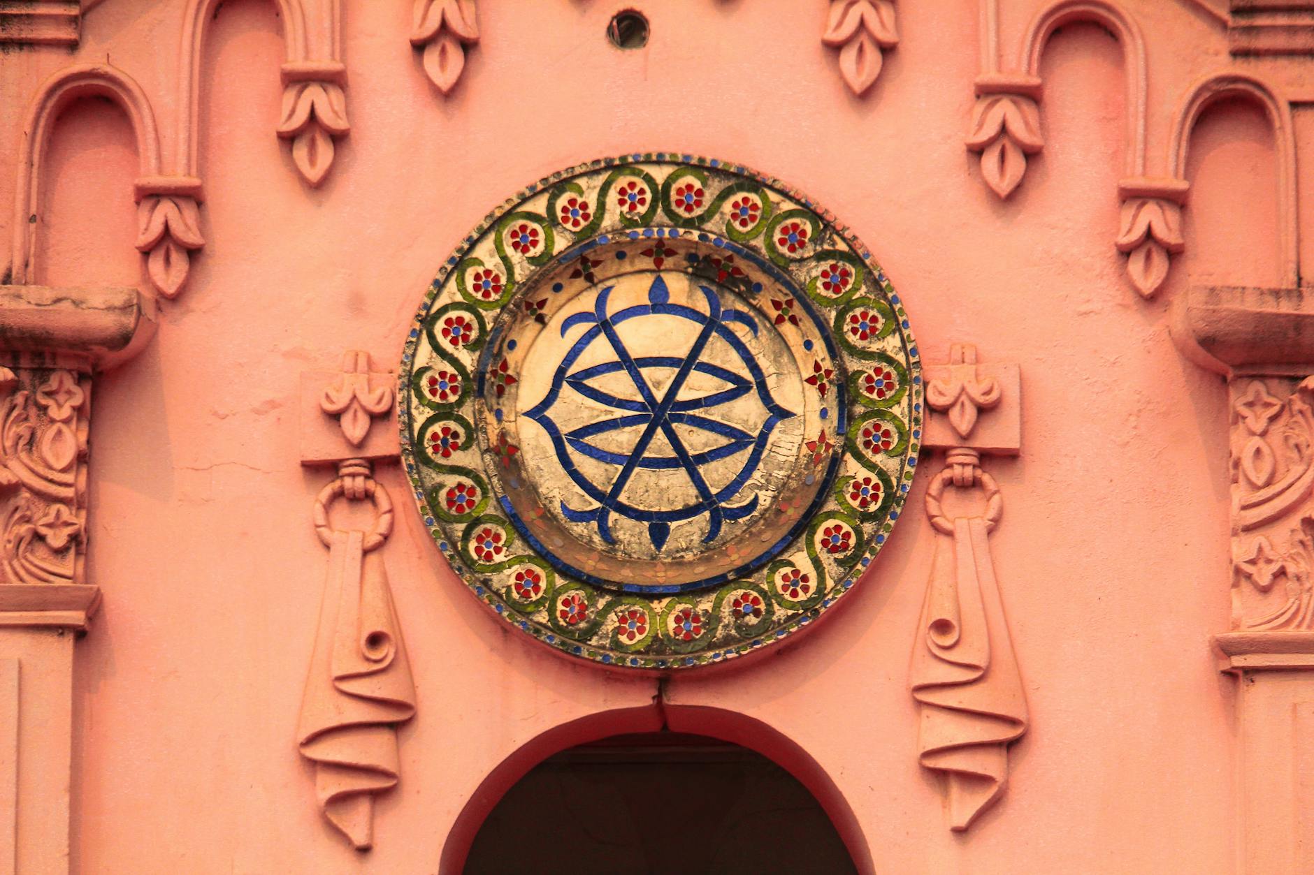 Intricate sacred geometry pattern carved into ancient stone, representing symbol systems and abstract sigil forms