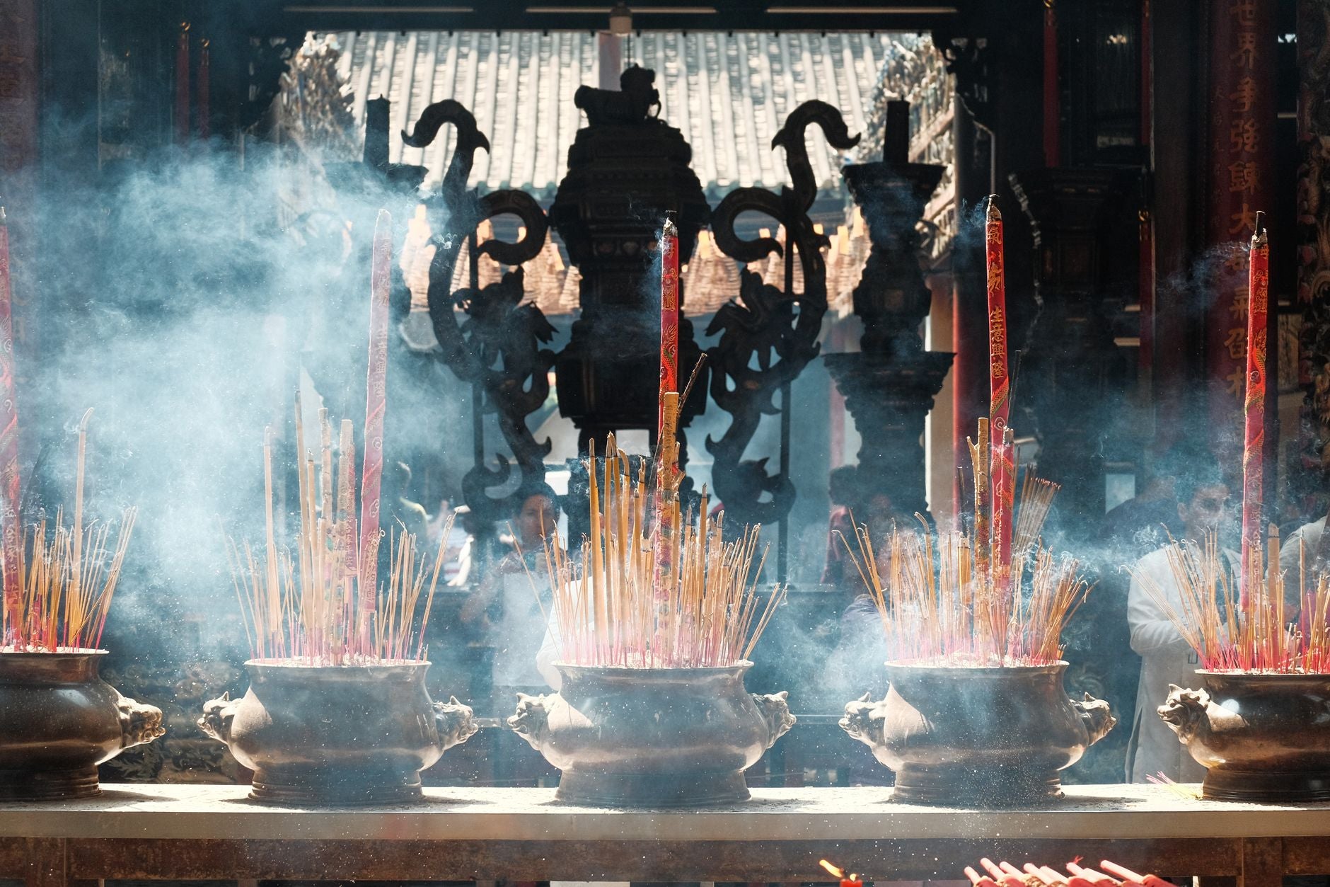 Incense smoke rising from candles on a ritual altar representing active protocol