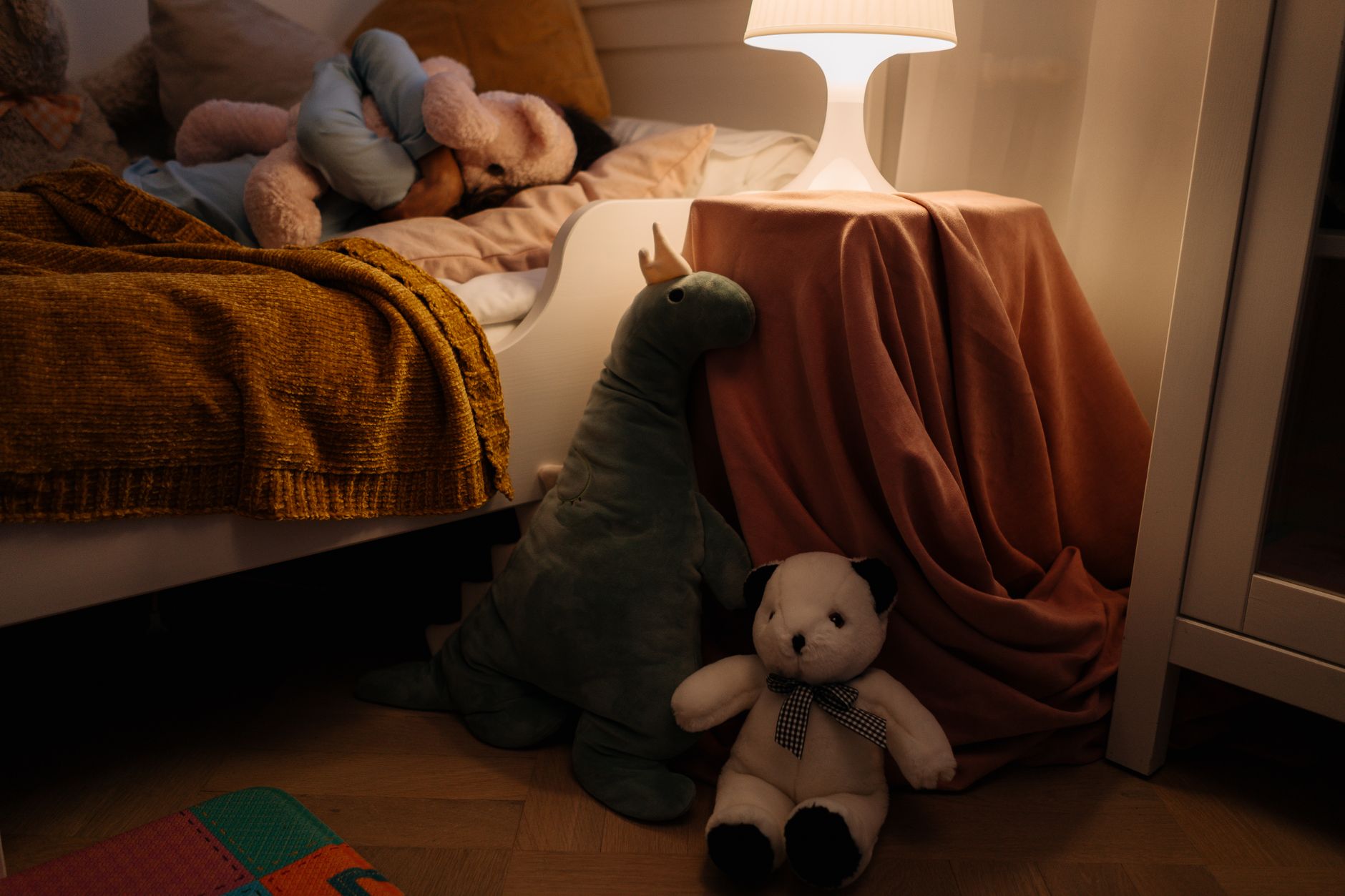Quiet bedroom with soft morning light and a child's belongings — the restored rhythm of an ordinary household