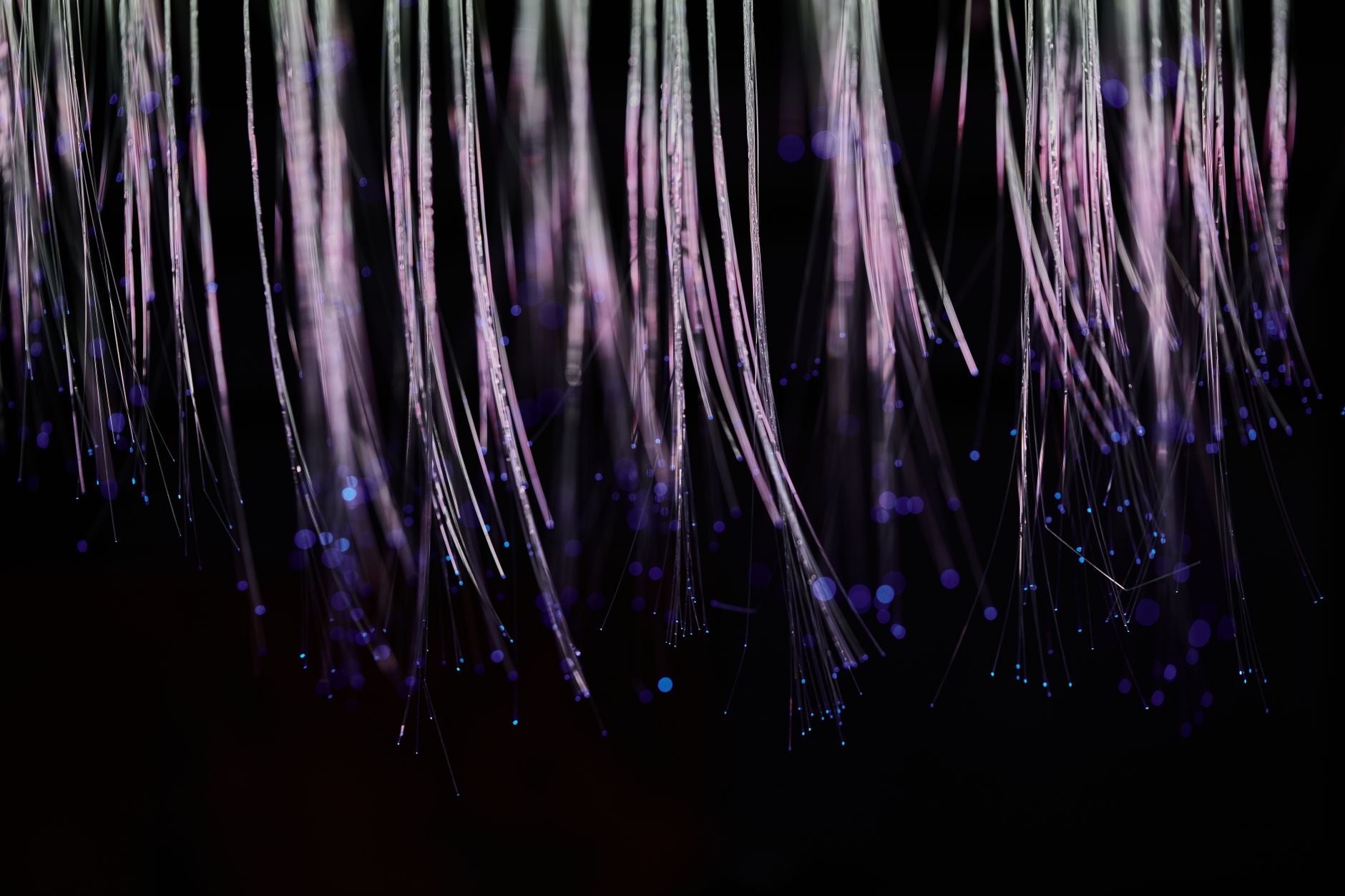 Two people connected by a glowing thread of light, invisible ties energetic bond