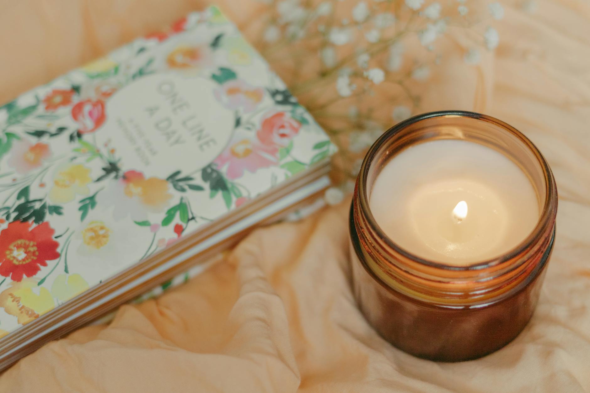 A book beside a burning candle, the disciplined study of hidden knowledge