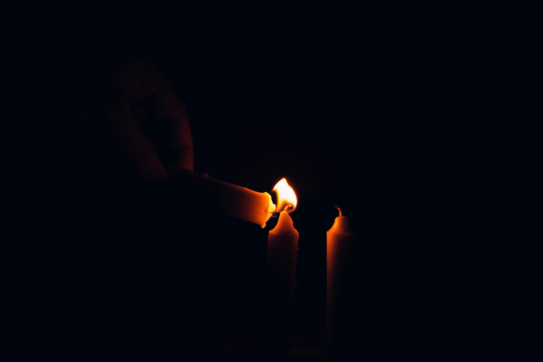 Candles burning in darkness, the working space of practical magick