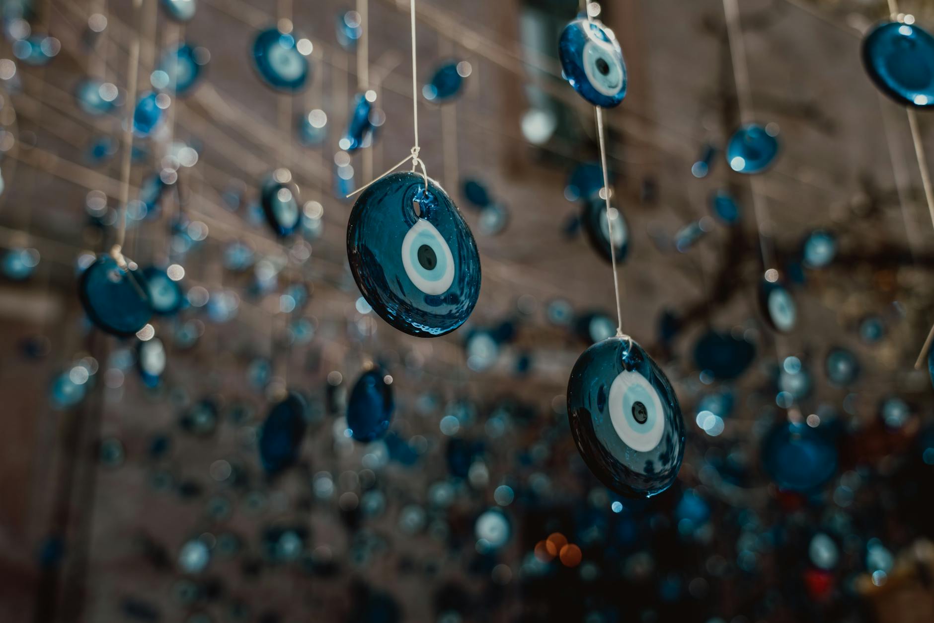 Blue glass evil eye beads, the traditional marker of the affliction this article diagnoses