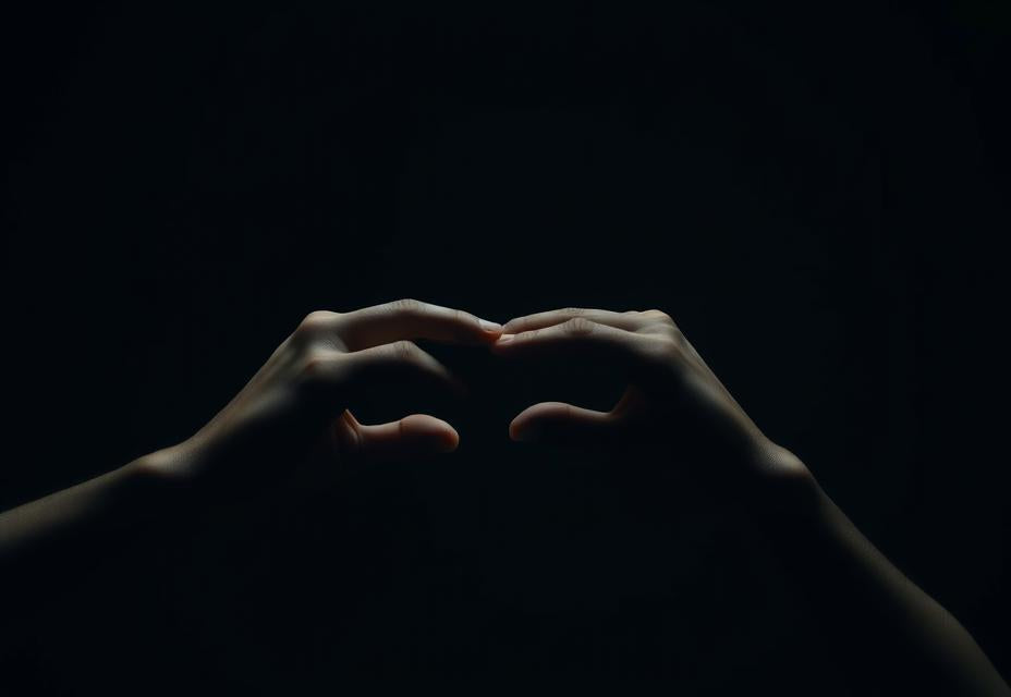 Hands making a deliberate cutting gesture in the air, a symbolic release motion