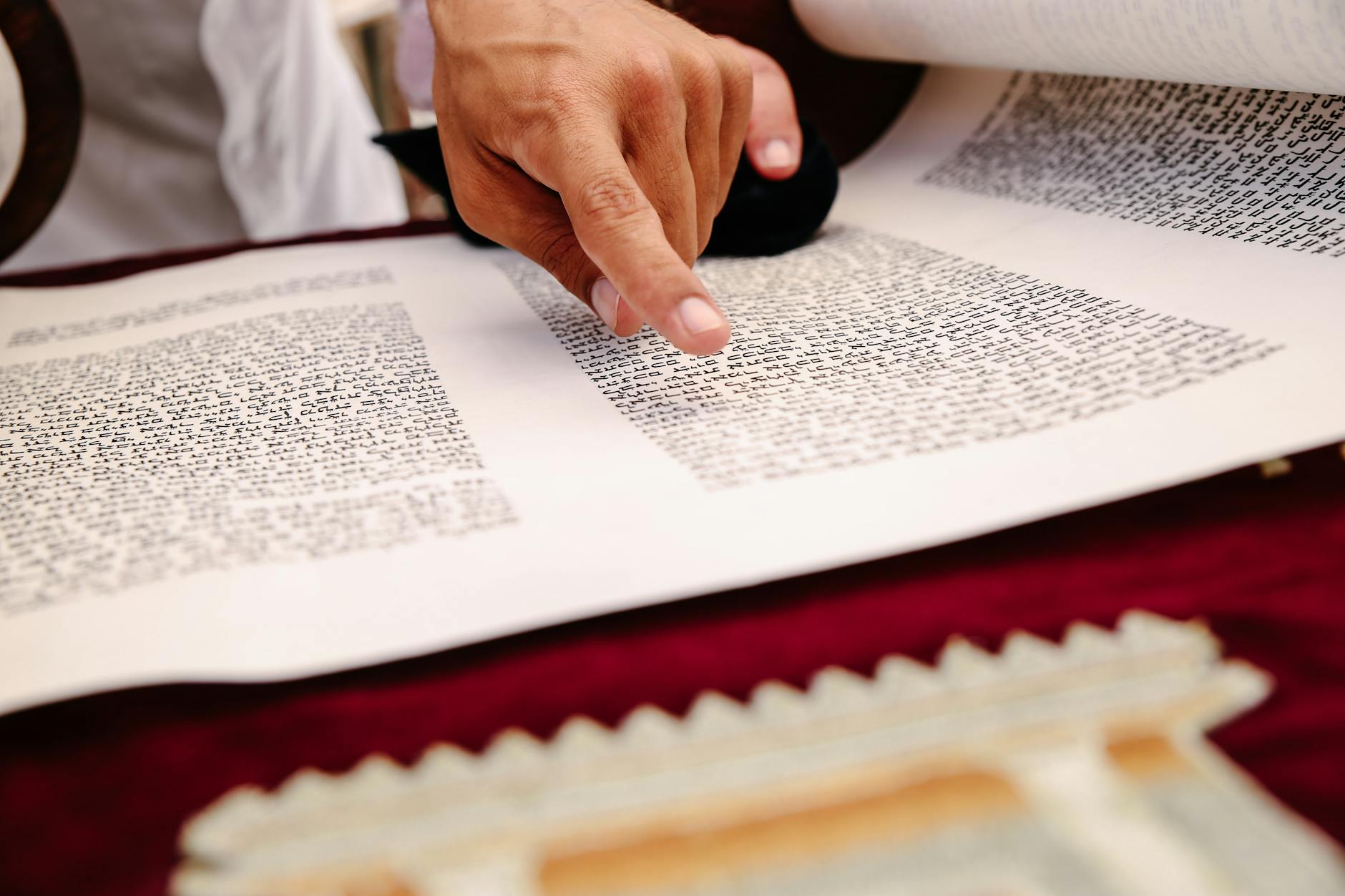 A person reading an old scroll, the ancient wisdom behind the hermetic principles