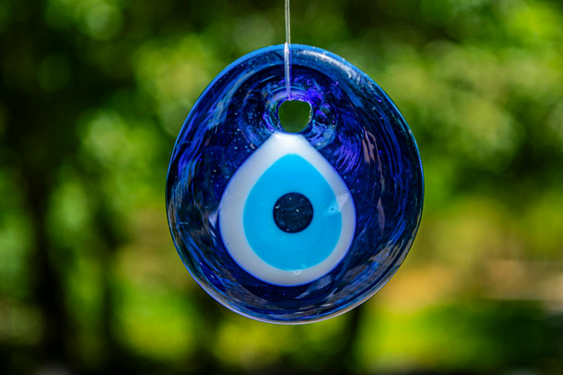 Traditional blue evil eye protection amulet pendant outdoors